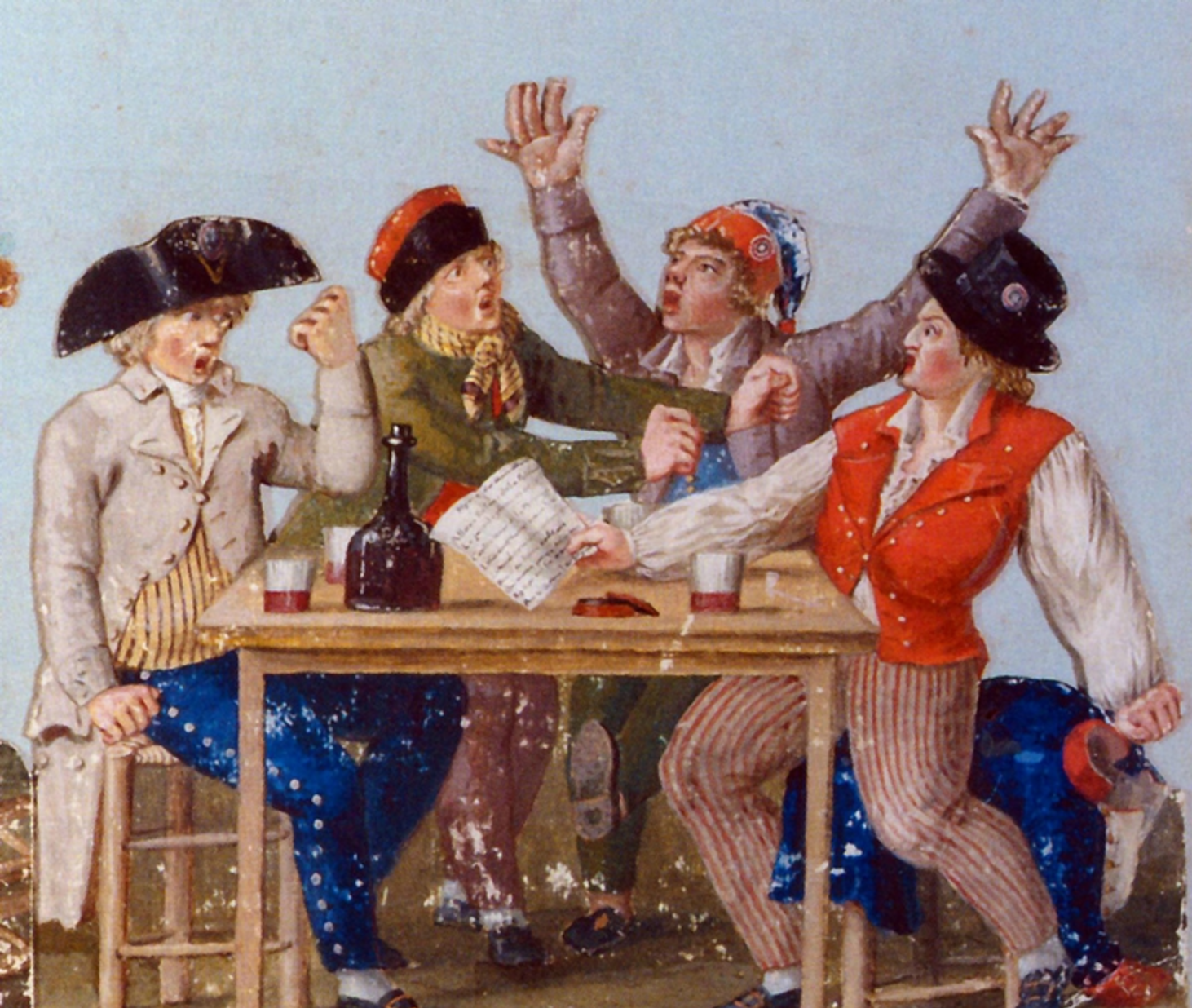 Four men singing and drinking at a table.