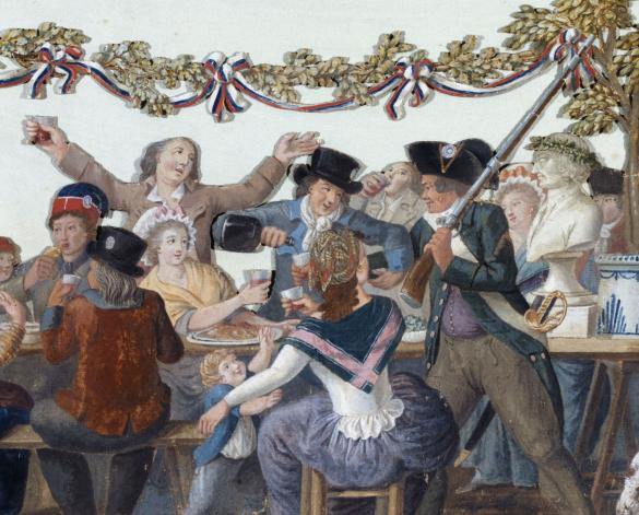 Men and women eating and drinking at a table outdoors. 