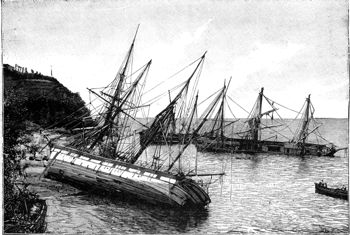 Boats run aground a beach in Martinique. 