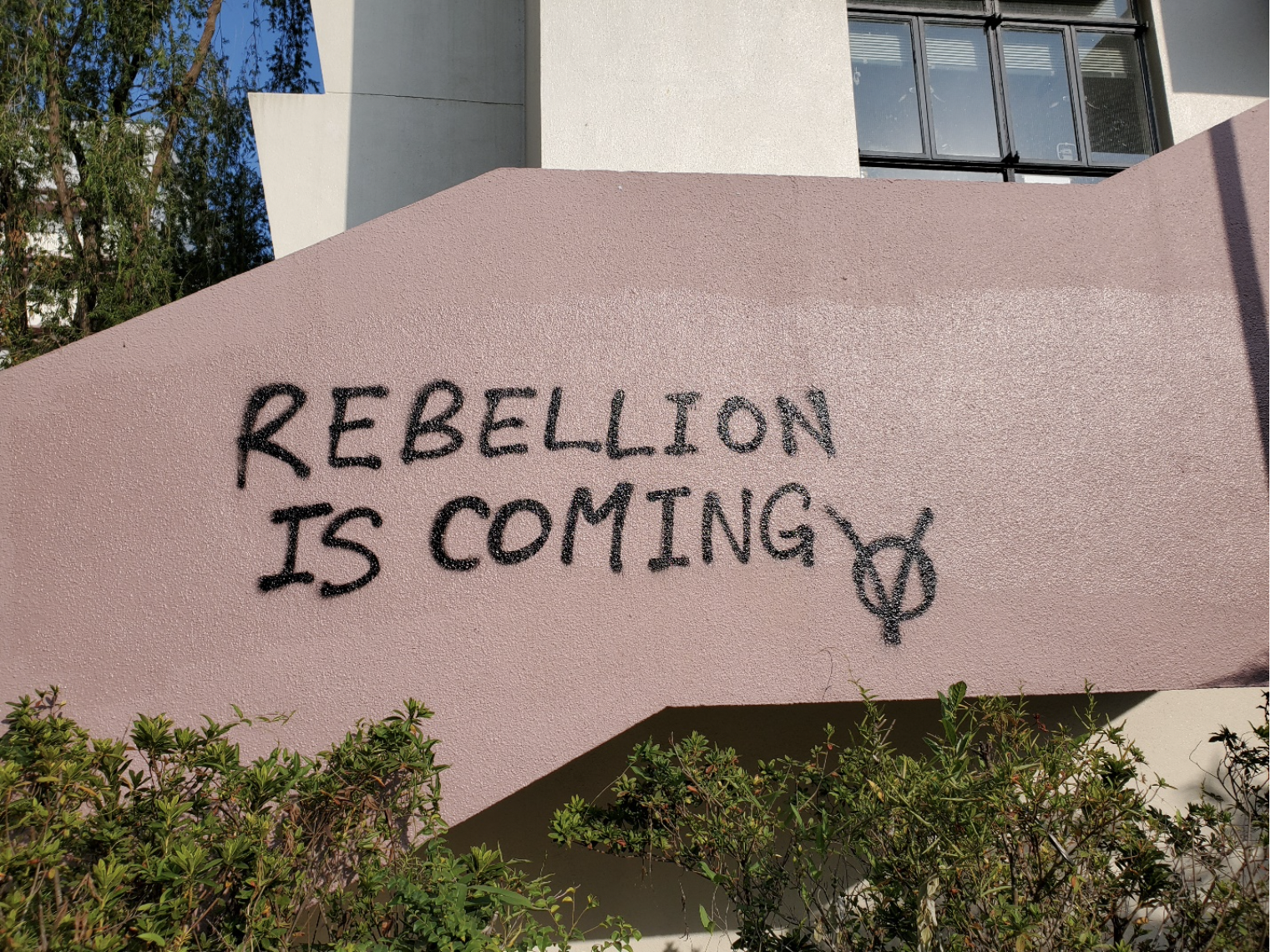 Graffiti that reads "Rebellion is coming" on the CUHK campus.