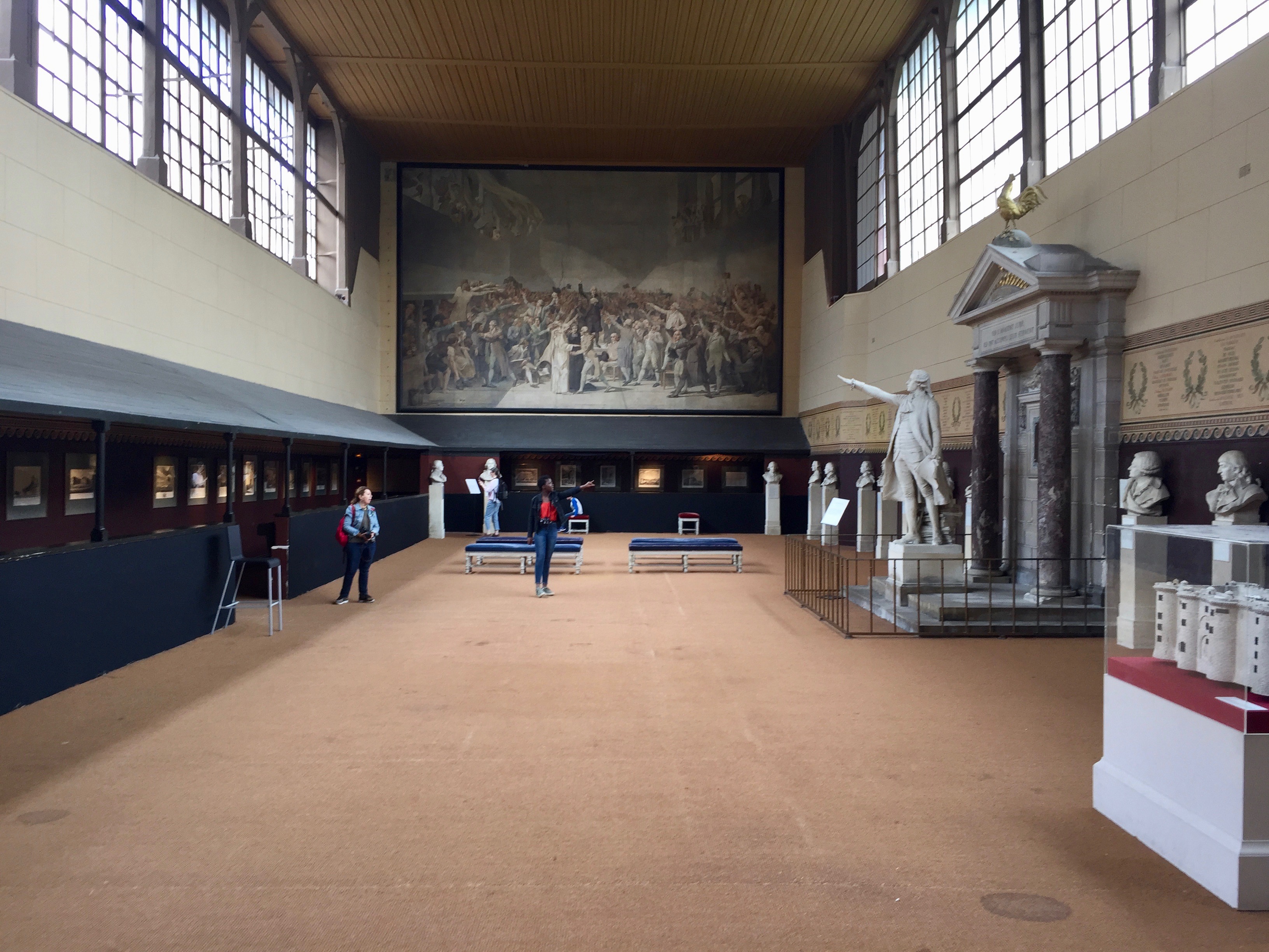 Room where the Oath of the Tennis Court took place, featuring a painting of the even and statues of participants.