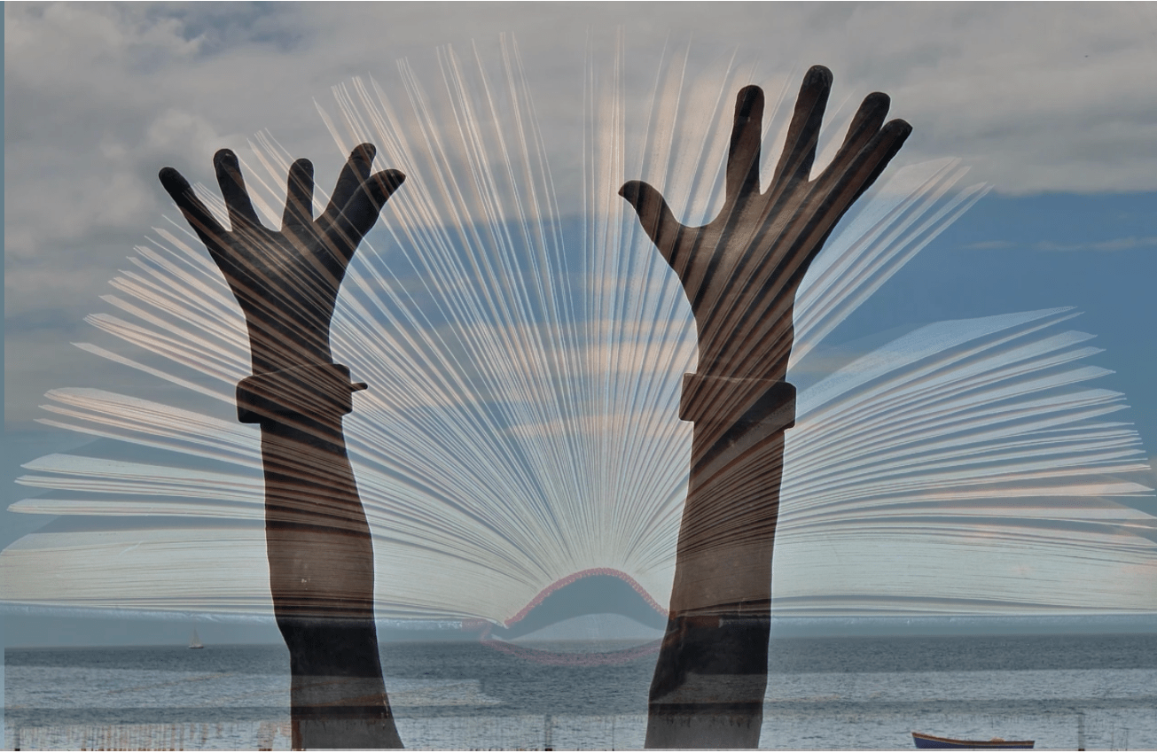 Photograph of two hands in the air and an open book layered on.