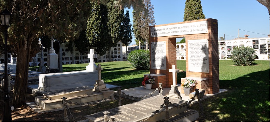 Monument to Franco's victims with an arch and stone crosses.