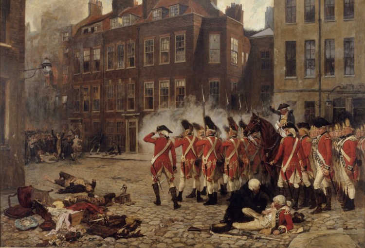 A group of British soldiers in a street during a confrontation.