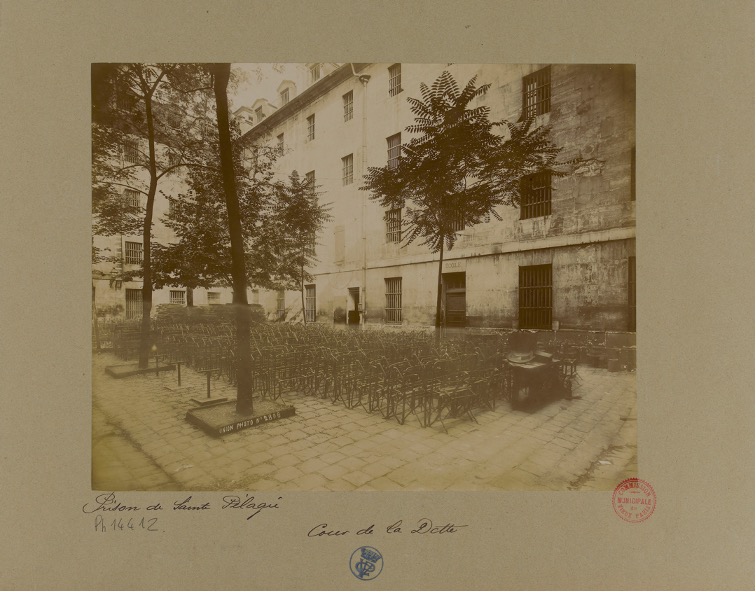 Black and white picture of chairs gathered for an assembly.