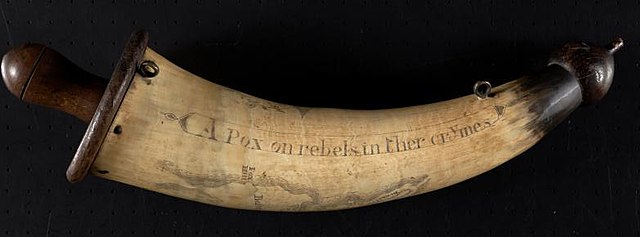 A Loyalist Powder Horn with maps of Boston and Charleston